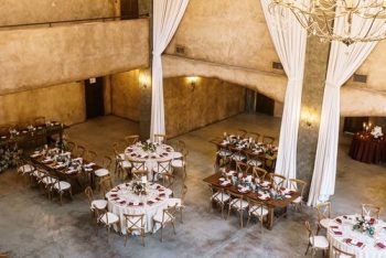 Elegant banquet hall set up with round tables for a formal event.